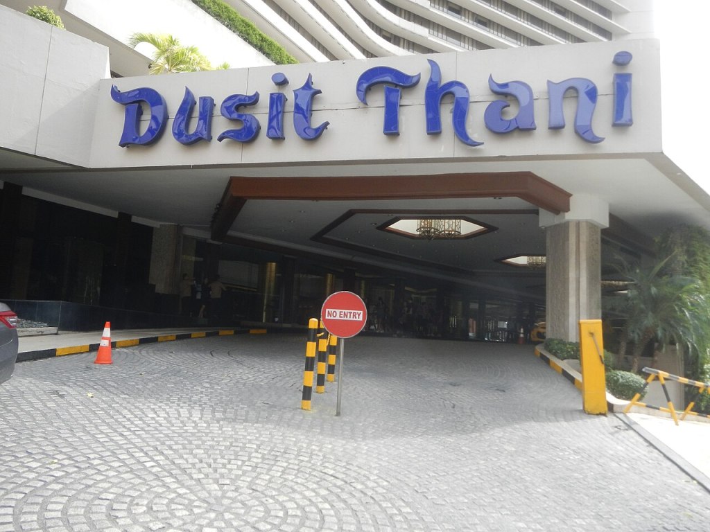 Driveway entrance and Dusit Thani sign at the Makati hotel
