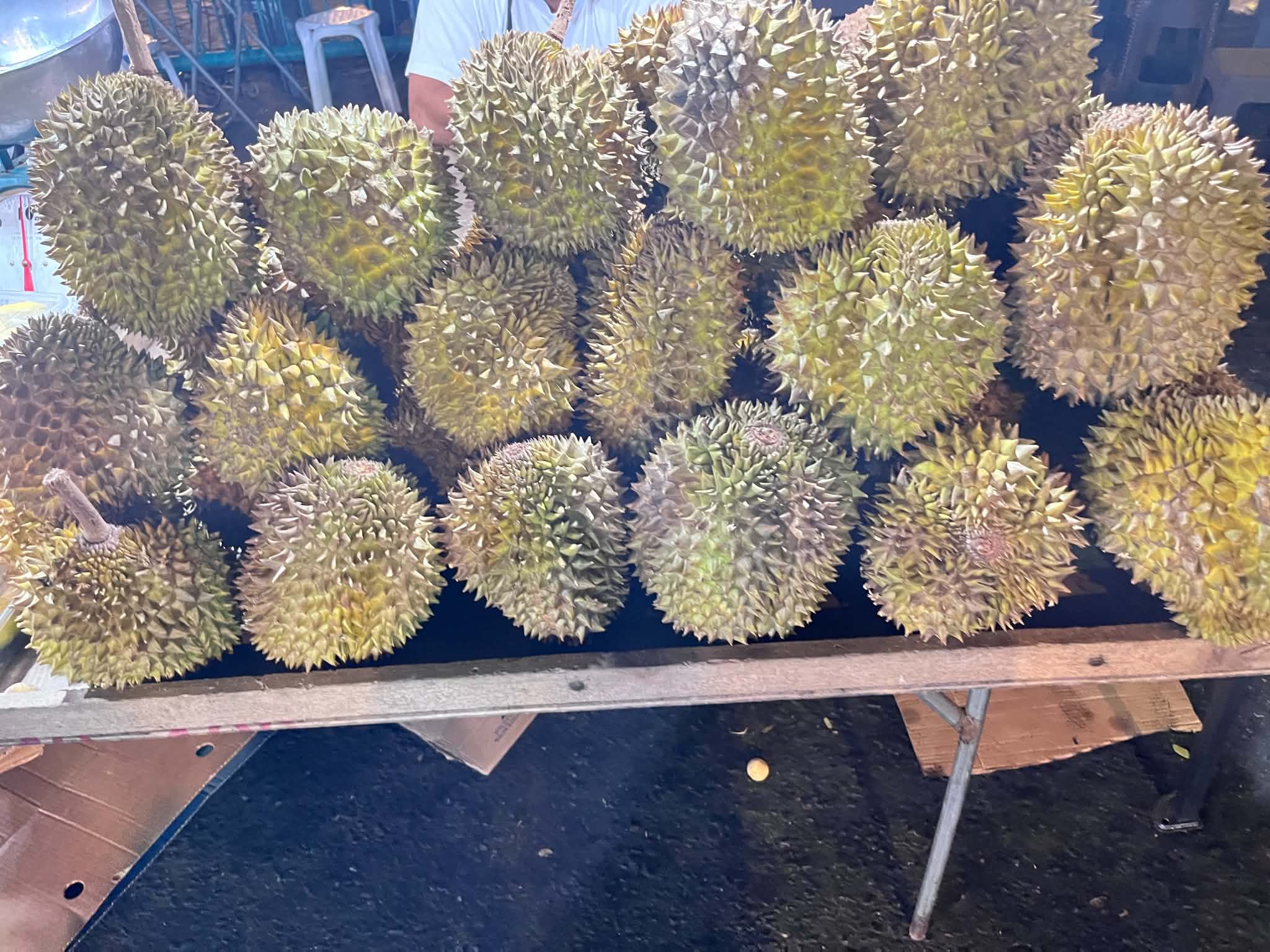 Fresh whole durian fruits stacked for sale in Davao City